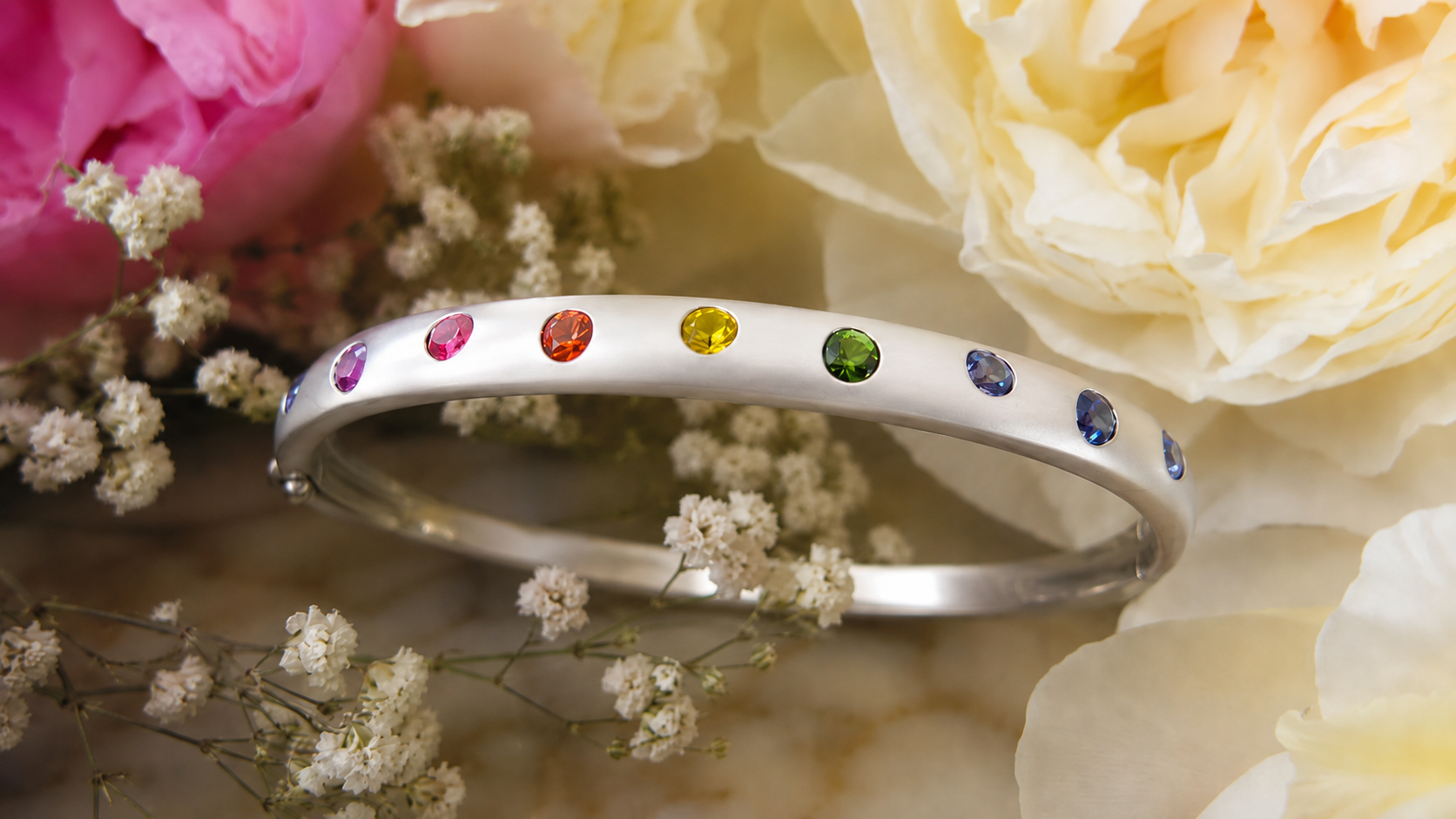 Natural rainbow sapphire bracelet in 14k white gold with burnished round sapphires