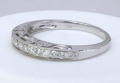 An antique style white gold diamond ring with a curved pavé band and an openwork filigree section, shown on a white background. The inside of the band is stamped with '14K'.