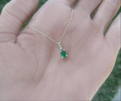 Oval Cut genuine emerald solitaire pendant with diamond bail in 14k yellow gold