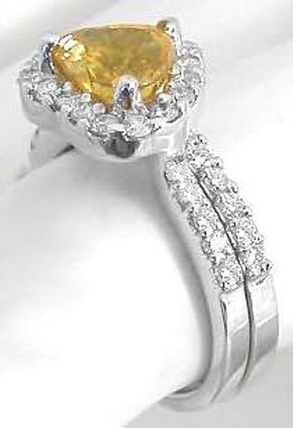 Heart cut unheated natural orange sapphire engagement ring set in 14k white gold