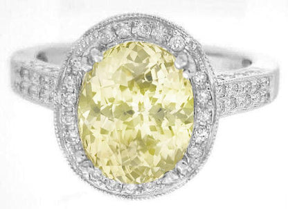 Large Natural oval yellow sapphire diamond halo ring in white gold with milgrain edging