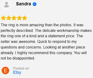 A screenshot of an Etsy review by Sandra with five yellow stars and a long positive review about a ring, on a light gray background.