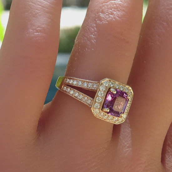 diamond halo setting with magenta sapphire square cut at the center with a split shank in rose gold shown on the finger