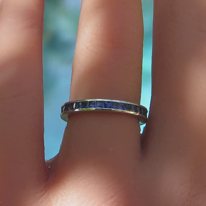 channel set princess cut ceylon sapphire eternity band in platinum on the finger