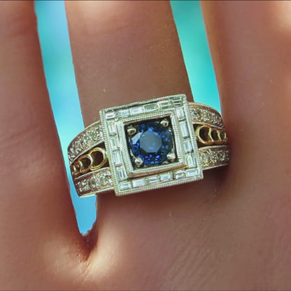 bold blue sapphire and baguette diamond ring with square halo and wide band in two tone metal 14k on ladies' finger