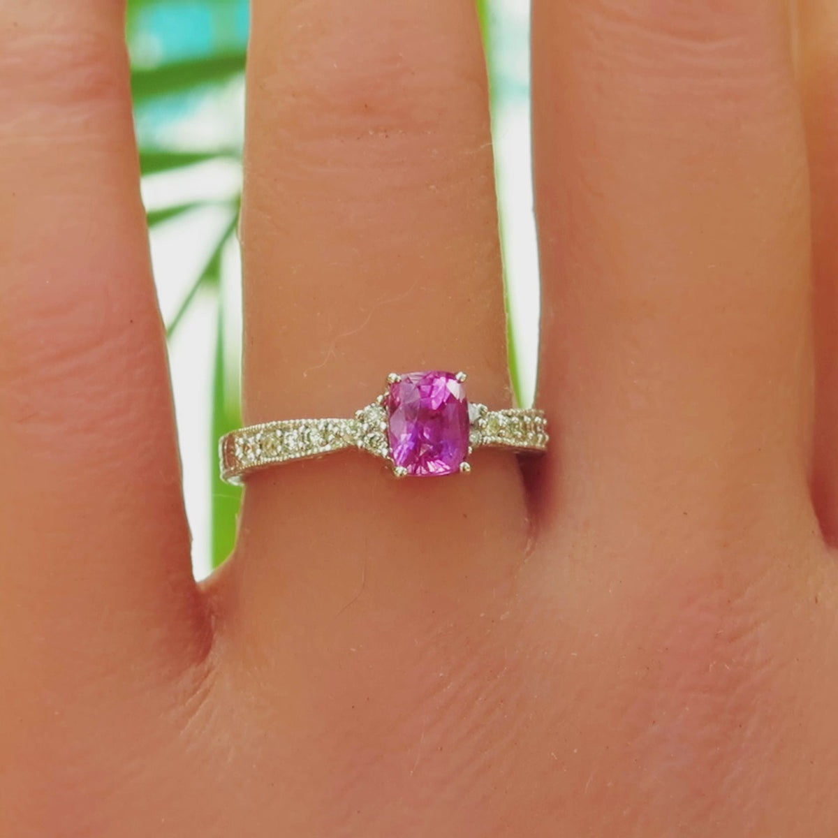 vintage styled pink sapphire ring shown on the finger