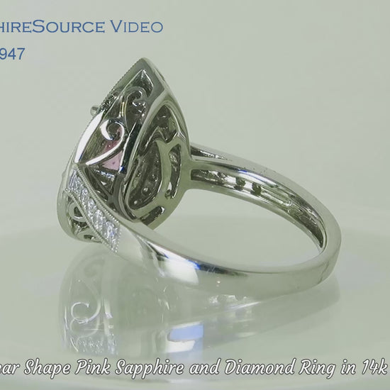 Large double diamond halo ring featuring light pink sapphire in a pear shape on a turntable