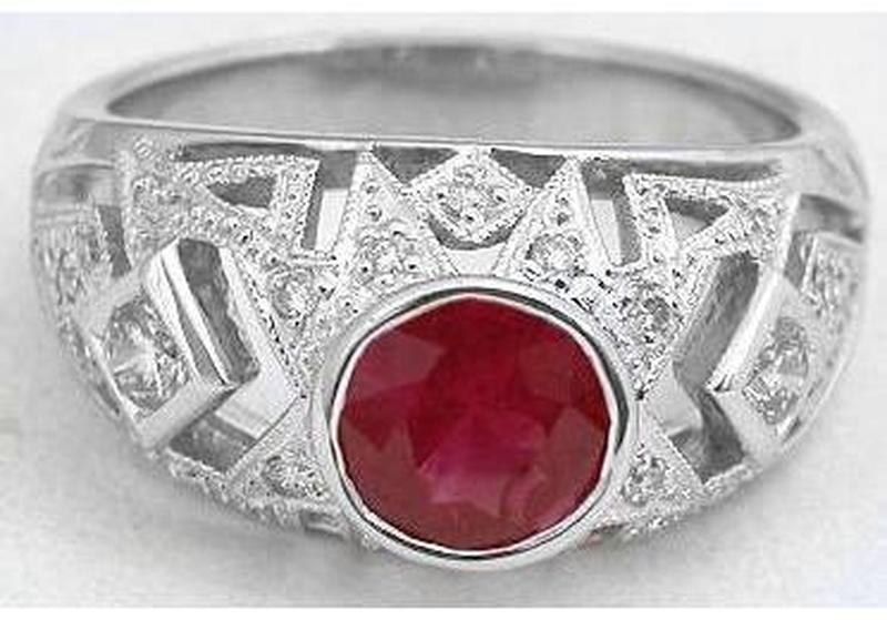 Bezel set round cut natural sapphire ring in 18k white gold