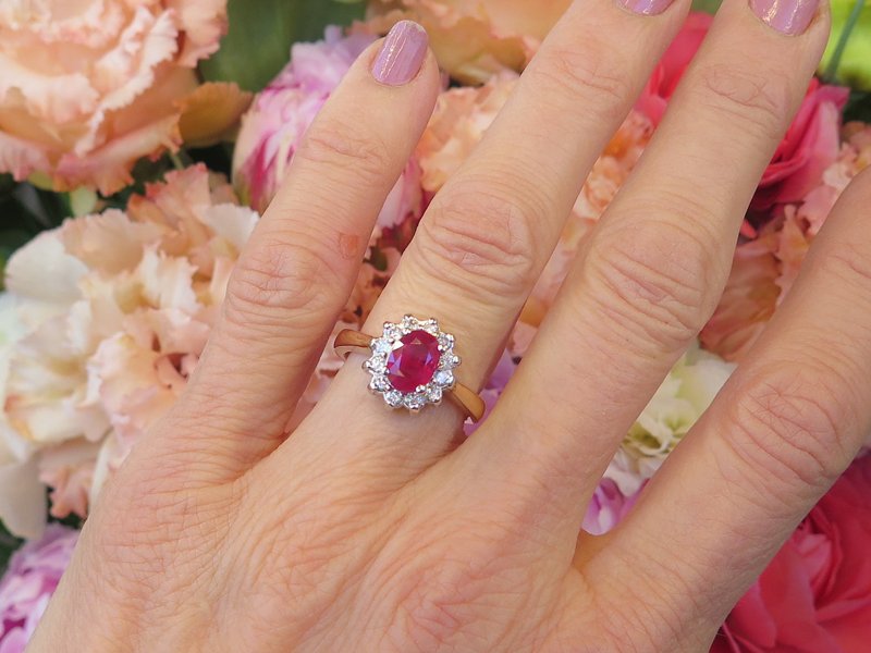Oval Natural Ruby and Diamond Halo Ring in 14k white and yellow gold