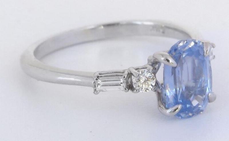 Cornflower blue sapphire ring with baguette and round diamond accents