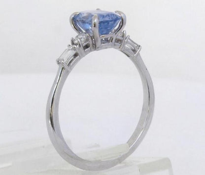 Natural blue sapphire engagement ring with diamond side stones
