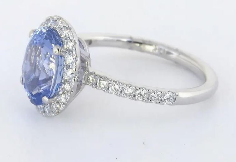Cornflower blue Ceylon sapphire and diamond halo ring in white gold