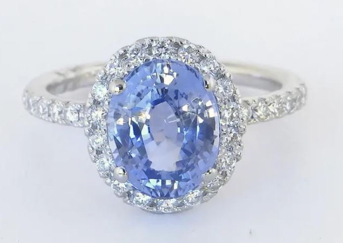 Rare unheated Ceylon sapphire ring surrounded by sparkling diamonds