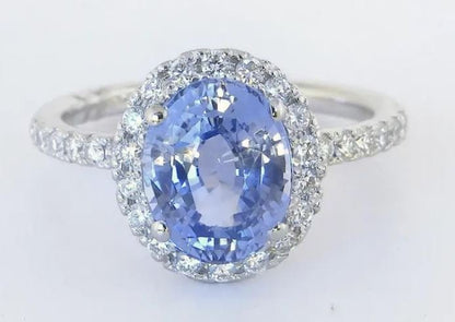 Rare unheated Ceylon sapphire ring surrounded by sparkling diamonds