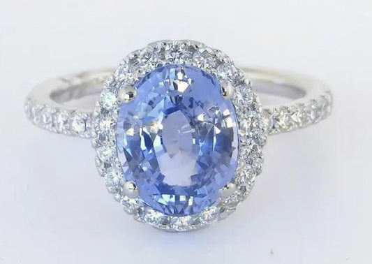 Rare unheated Ceylon sapphire ring surrounded by sparkling diamonds