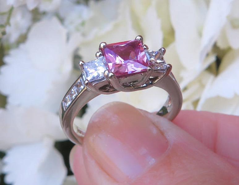 Natural Princess Cut Pink Sapphire Three Stone Diamond Wedding Ring with Princess Cut Side Diamonds in a 14k white gold setting for sale
