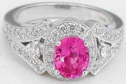 Oval cut natural pink sapphire ring in 14k white gold