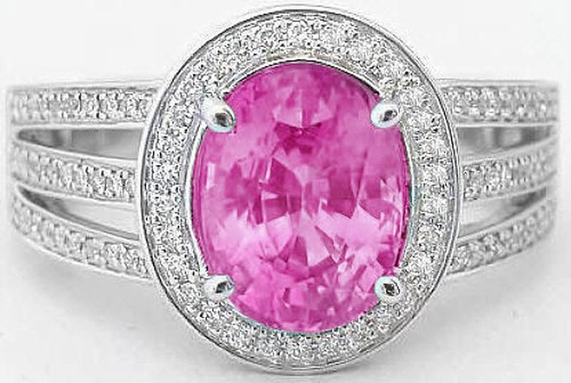 Oval cut natural pink sapphire ring in 14k white gold