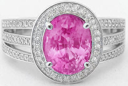 Oval cut natural pink sapphire ring in 14k white gold