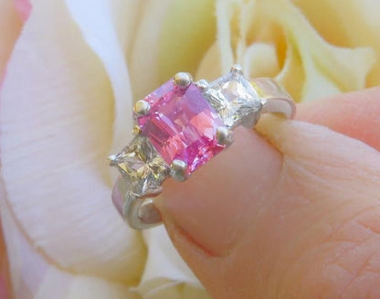 Natural radiant cut pink sapphire and princess cut natural white sapphire three stone ring in solid platinum for sale