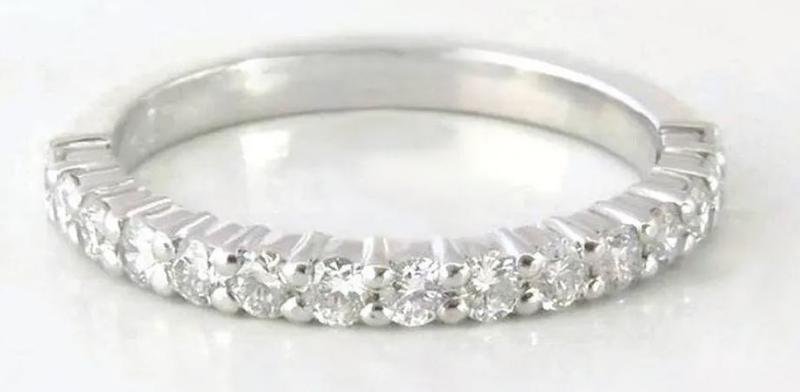 Natural trillion cut pink sapphire ring with a diamond halo in 14k white gold shown with it's matching diamond band