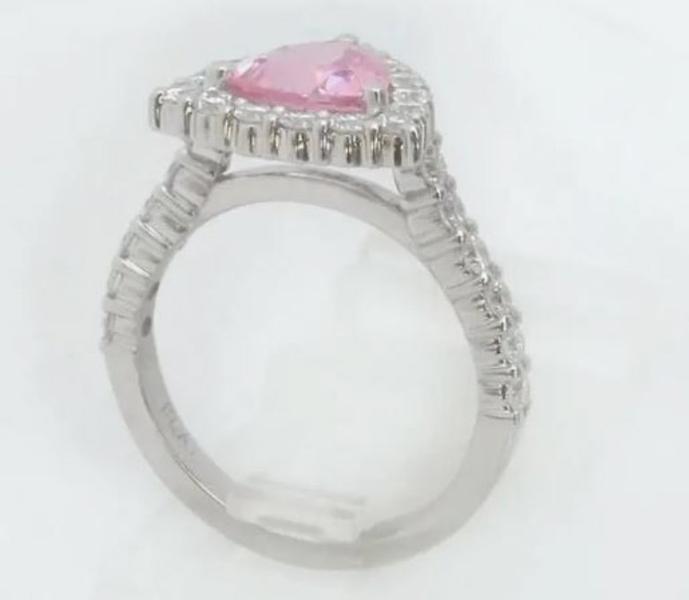 Natural trillion cut pink sapphire ring with a diamond halo in 14k white gold shown upright view