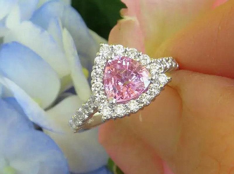 Natural trillion cut pink sapphire ring with a diamond halo in 14k white gold