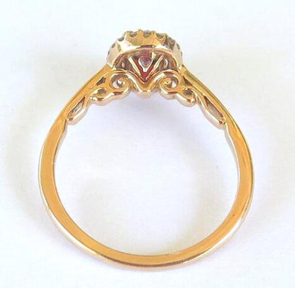 Top view of pink sapphire ring showing ornate detailing