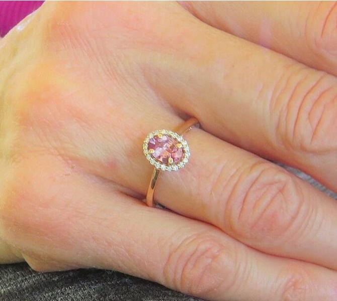 Natural Ceylon rosy pink sapphire ring in 14k rose gold with a diamond halo