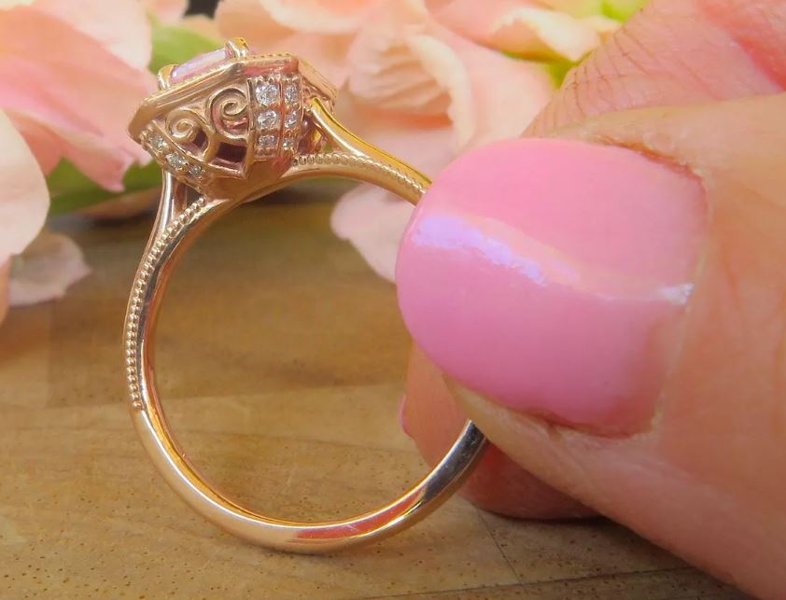 Rose gold engagement ring with radiant pink sapphire center