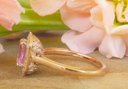 Pastel pink Ceylon sapphire ring with diamond halo
