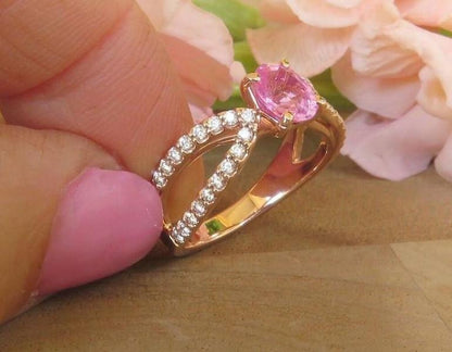 Elegant rose gold ring featuring vivid pink sapphire and diamonds