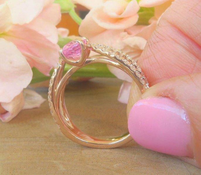 Pink sapphire gemstone ring with diamond-studded split design