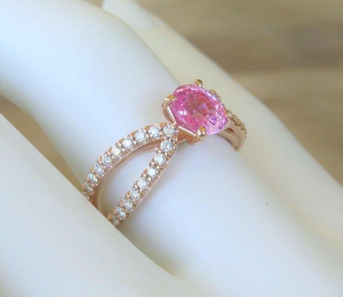 Natural oval pink sapphire ring in 14k rose gold with diamond accents