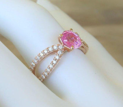 Natural oval pink sapphire ring in 14k rose gold with diamond accents