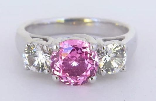 three-stone pink sapphire and white sapphire ring in 18k white gold