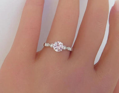 natural pink sapphire solitaire ring with milgrain diamond setting