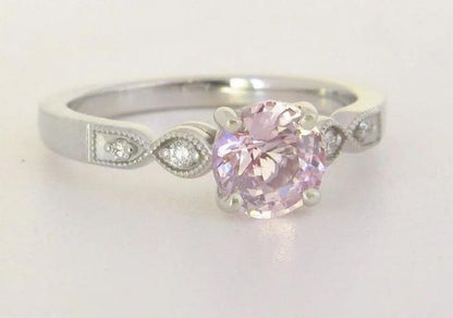 feminine pale pink sapphire and diamond ring in white gold band