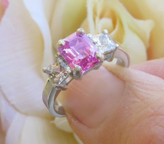 Radiant cut natural pink sapphire and princess cut natural white sapphire three stone engagement ring in solid platinum for sale
