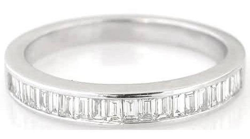 A white gold band ring featuring a row of baguette-cut clear gemstones along the lower half, shown on a plain white background.