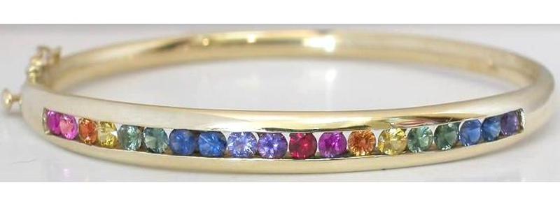 Channel Set Natural Rainbow Sapphire Bangle Bracelet in solid 14k yellow gold. LGTB pride.
