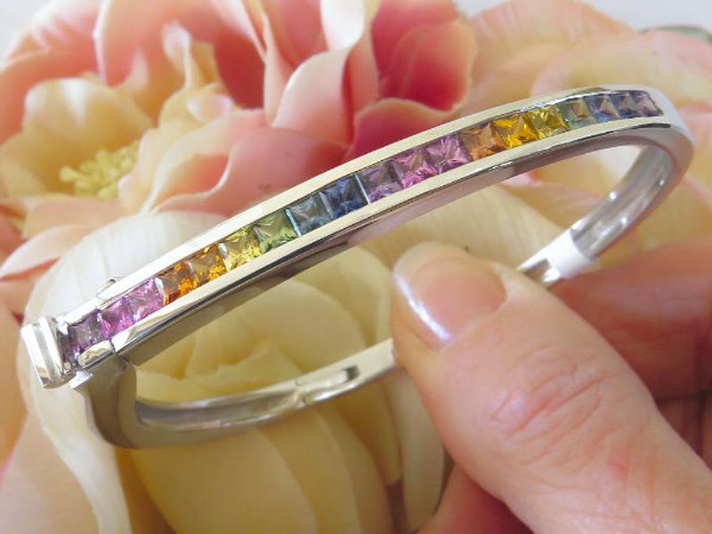 Natural Rainbow Sapphire Bangle Bracelet in solid1 4k white gold with real princess cut sapphires.