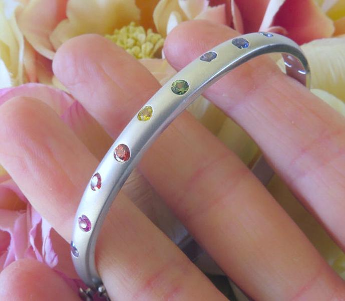 Natural Rainbow Sapphire Bangle with burnished round multicolor real sapphires set in solid 14k white gold.