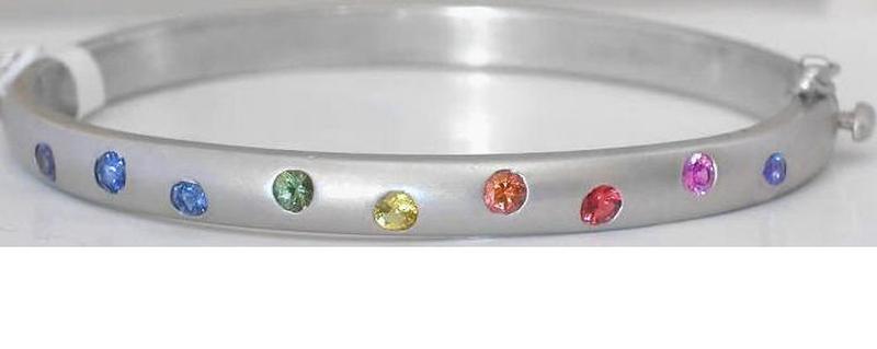 Natural Rainbow Sapphire Bangle Bracelet with burnished round multicolor real sapphires set in solid 14k white gold for sale.