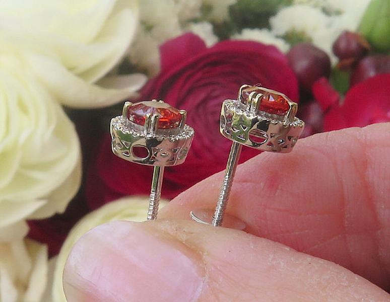 Natural Orange Red Sapphire Stud Earrings with a real diamond halo set in solid 14k white gold