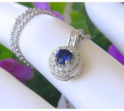 Royal Blue Natural Sapphire Pendant with a Diamond Halo in solid 14k white gold for sale