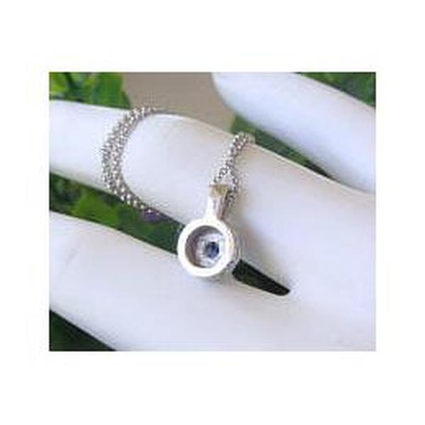 Back view of blue sapphire and diamond necklace