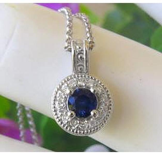 Royal Blue Natural Sapphire Pendant with a Diamond Halo in solid 14k white gold for sale
