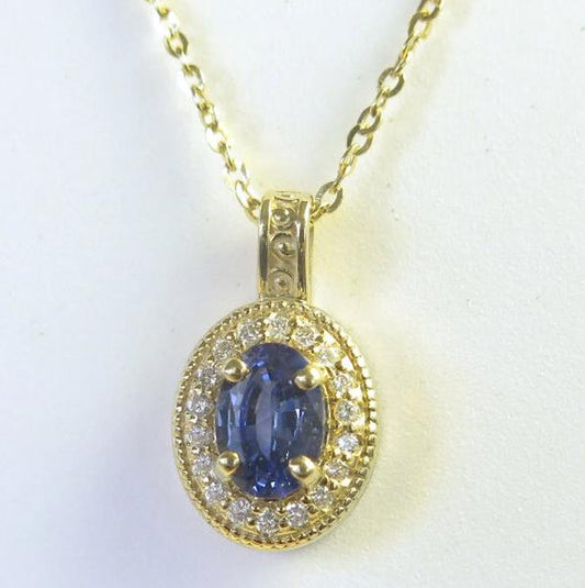 Oval Blue Sapphire and Diamond Pendant in 14k yellow gold with a 16 inch 14k yellow gold chain