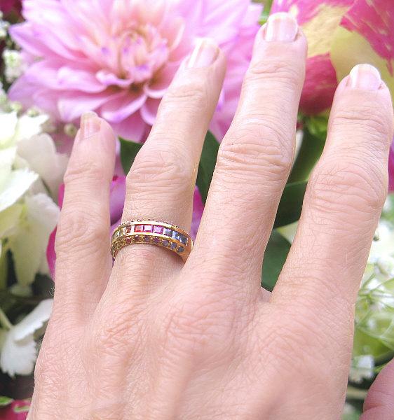 Hand View of Gorgeous Princess and Round Cut Natural Rainbow Sapphires in 14k yellow gold
